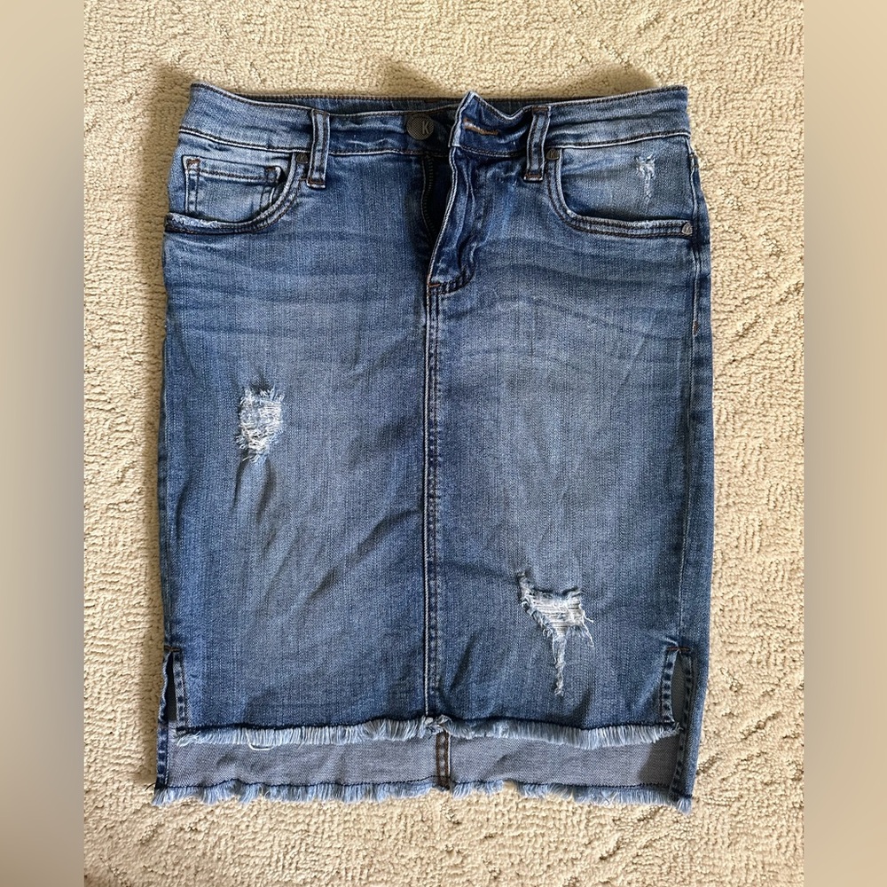 Jean skirt with slight high low frayed hem; slight distressing on front